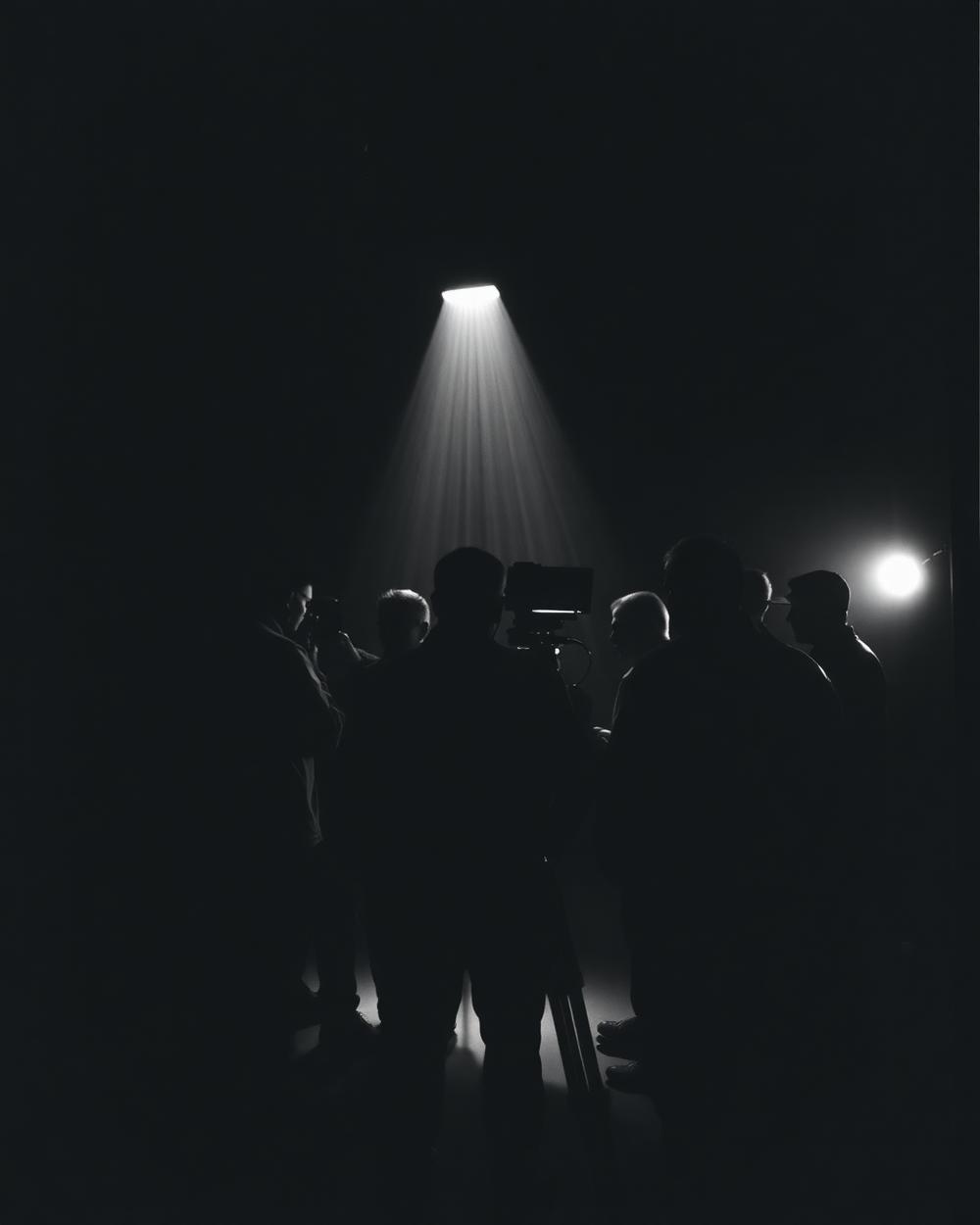 Frequency Visuals crew on a darkened film set